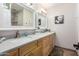 Bathroom featuring a dual sink vanity with plenty of counter space at 5318 W Aire Libre Ave, Glendale, AZ 85306