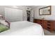 Cozy bedroom featuring a mid-century modern dresser and closet space at 5318 W Aire Libre Ave, Glendale, AZ 85306