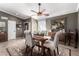 Formal dining room with a ceiling fan, decorative rug, and classic furnishings at 5318 W Aire Libre Ave, Glendale, AZ 85306