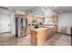 Bright kitchen featuring stainless steel appliances, light wood cabinetry, and ample counter space at 5318 W Aire Libre Ave, Glendale, AZ 85306