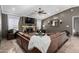 Spacious living room with a large leather sectional, stone fireplace, and recessed lighting at 5318 W Aire Libre Ave, Glendale, AZ 85306