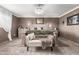 Elegant main bedroom with an accent wall, a comfortable bed, and stylish decor at 5318 W Aire Libre Ave, Glendale, AZ 85306