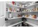 Well-stocked pantry with ample shelving for organized storage at 5318 W Aire Libre Ave, Glendale, AZ 85306