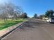 Street view of a well-maintained residential neighborhood with sidewalks and nearby community park at 5318 W Aire Libre Ave, Glendale, AZ 85306