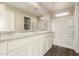 Bathroom featuring dual sinks with a large mirror and a shower-tub combo at 5430 W Odeum Ln, Phoenix, AZ 85043