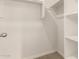 Walk-in closet with shelving for maximum storage capacity at 5430 W Odeum Ln, Phoenix, AZ 85043