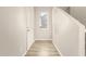 Bright entryway with durable wood-look flooring and a modern, minimalist aesthetic at 5430 W Odeum Ln, Phoenix, AZ 85043