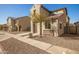 Charming two-story home with stone accents and a well-manicured desert landscape at 5430 W Odeum Ln, Phoenix, AZ 85043