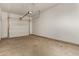 Spacious garage with a clean concrete floor and an automatic door opener at 5430 W Odeum Ln, Phoenix, AZ 85043