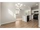 Kitchen and dining area with a breakfast bar, seamless design and an open floorplan at 5430 W Odeum Ln, Phoenix, AZ 85043