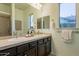 Bathroom with double sink vanity, granite countertop, framed mirror, and separate shower at 5921 E Ocupado Dr, Cave Creek, AZ 85331