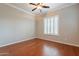 This bedroom features hardwood floors, neutral walls, and a bright window with wood shutter blinds at 5921 E Ocupado Dr, Cave Creek, AZ 85331