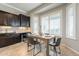 Bright dining area boasts modern table set, dark wood cabinets, and plenty of natural light through shuttered windows at 5921 E Ocupado Dr, Cave Creek, AZ 85331