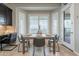 Charming dining space with seating for four, stylish decor, and bright natural light from the adjacent door and windows at 5921 E Ocupado Dr, Cave Creek, AZ 85331