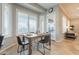 Cozy dining area features large windows with plantation shutters, flooding the space with natural light at 5921 E Ocupado Dr, Cave Creek, AZ 85331