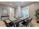 Elegant dining room with modern table, seating for six, with neutral wall color and decor at 5921 E Ocupado Dr, Cave Creek, AZ 85331