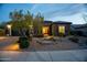 Inviting home featuring a well-lit walkway and professionally landscaped front yard at 5921 E Ocupado Dr, Cave Creek, AZ 85331