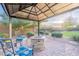 Backyard gazebo featuring a fire pit, patio furniture, brick floor, and sunset views at 5921 E Ocupado Dr, Cave Creek, AZ 85331