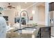 Stylish kitchen sink area with pendant lighting and view into adjacent living room at 5921 E Ocupado Dr, Cave Creek, AZ 85331