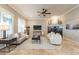 Inviting living room with a fireplace, modern furnishings, and ample natural light at 5921 E Ocupado Dr, Cave Creek, AZ 85331