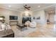 Bright living room featuring a fireplace, neutral decor, and tile flooring at 5921 E Ocupado Dr, Cave Creek, AZ 85331