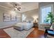 Bright main bedroom features neutral tones, plush carpeting, and a cozy seating area with natural light at 5921 E Ocupado Dr, Cave Creek, AZ 85331