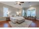 Spacious main bedroom with hardwood floors, plantation shutters, and a cozy sitting area at 5921 E Ocupado Dr, Cave Creek, AZ 85331