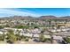 Aerial view of community featuring single-story homes and desert landscaping with mountain views at 6401 W Irma Ln, Glendale, AZ 85308