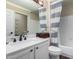 Bathroom featuring a vanity and tub/shower with stylish curtain, blending functionality with design at 6401 W Irma Ln, Glendale, AZ 85308