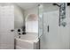 Bright bathroom featuring a separate tub and tiled glass shower, perfect for relaxing and modern living at 6401 W Irma Ln, Glendale, AZ 85308