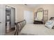 Comfortable bedroom with sliding closet doors and connecting hallway, providing a functional layout at 6401 W Irma Ln, Glendale, AZ 85308