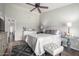 Bright bedroom with accent lighting, neutral colored walls, wooden floors, ceiling fan, and decorative furniture at 6401 W Irma Ln, Glendale, AZ 85308