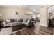 Comfortable living room with vaulted ceiling, a large sectional sofa, decor, and natural lighting at 6401 W Irma Ln, Glendale, AZ 85308