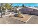 A playground features a slide, climbing structure and picnic table in a small park at 6401 W Irma Ln, Glendale, AZ 85308