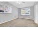 Neutral bedroom with plenty of natural light, carpeted floor, and a serene atmosphere at 6524 N 13Th St, Phoenix, AZ 85014