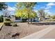 Charming single-story home featuring desert landscaping and eye-catching purple shutters at 6524 N 13Th St, Phoenix, AZ 85014