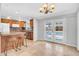 Bright kitchen with barstool seating that looks out French doors to the backyard and pool at 6524 N 13Th St, Phoenix, AZ 85014