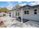 Covered patio with french doors leading to the backyard with seating area at 6524 N 13Th St, Phoenix, AZ 85014