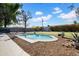 This backyard pool is surrounded by grass and gravel for low maintenance at 6524 N 13Th St, Phoenix, AZ 85014