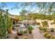 Serene backyard featuring a pool, lush plants, outdoor seating, and a built-in BBQ at 6845 N Hillside Dr, Paradise Valley, AZ 85253