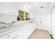 Bright white counter featuring sink, white cabinets, and a view to the back at 6845 N Hillside Dr, Paradise Valley, AZ 85253