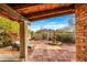 Charming courtyard featuring stone flooring, water fountain, comfortable seating, and desert plants at 6845 N Hillside Dr, Paradise Valley, AZ 85253