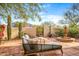 Inviting courtyard with stylish lounge chairs, water fountain feature, and desert landscaping at 6845 N Hillside Dr, Paradise Valley, AZ 85253