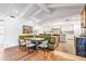 Bright dining area with built-in booth seating and open access to the modern kitchen at 6845 N Hillside Dr, Paradise Valley, AZ 85253