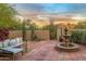 Outdoor patio with a comfortable seating area, desert landscaping, and mountain views at 6845 N Hillside Dr, Paradise Valley, AZ 85253