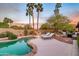 Backyard pool area with lounge chairs and a barbecue area for outdoor entertaining at 6845 N Hillside Dr, Paradise Valley, AZ 85253