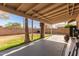 Covered back patio overlooks a large backyard with a block fence at 699 W Shannon St, Chandler, AZ 85225