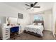 Cozy bedroom with makeup vanity, carpeted floors, and a ceiling fan at 699 W Shannon St, Chandler, AZ 85225