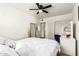 Well-lit bedroom with closet space, carpeted floors, and a ceiling fan at 699 W Shannon St, Chandler, AZ 85225