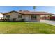 Charming single-story home featuring a well-maintained lawn and a convenient covered carport at 699 W Shannon St, Chandler, AZ 85225